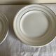 Set of 8 modernist flat plates in fine earthenware with pure gold trim, 1930.