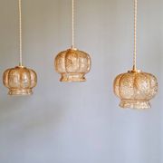 Vintage trio of amber glass pendants, 1960s-70s.