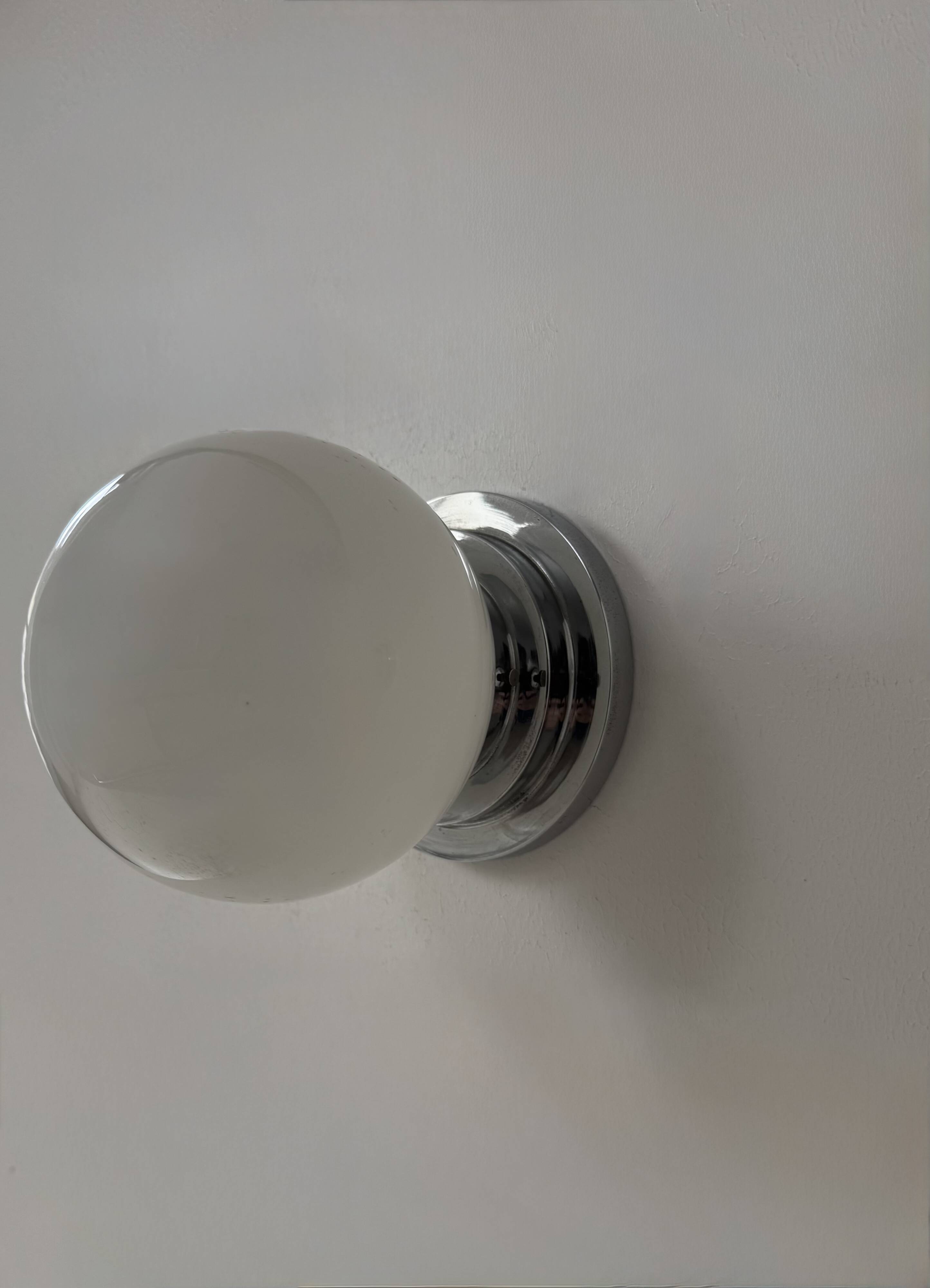 Pair of vintage modernist Art Deco wall lights, chrome and opaline, France