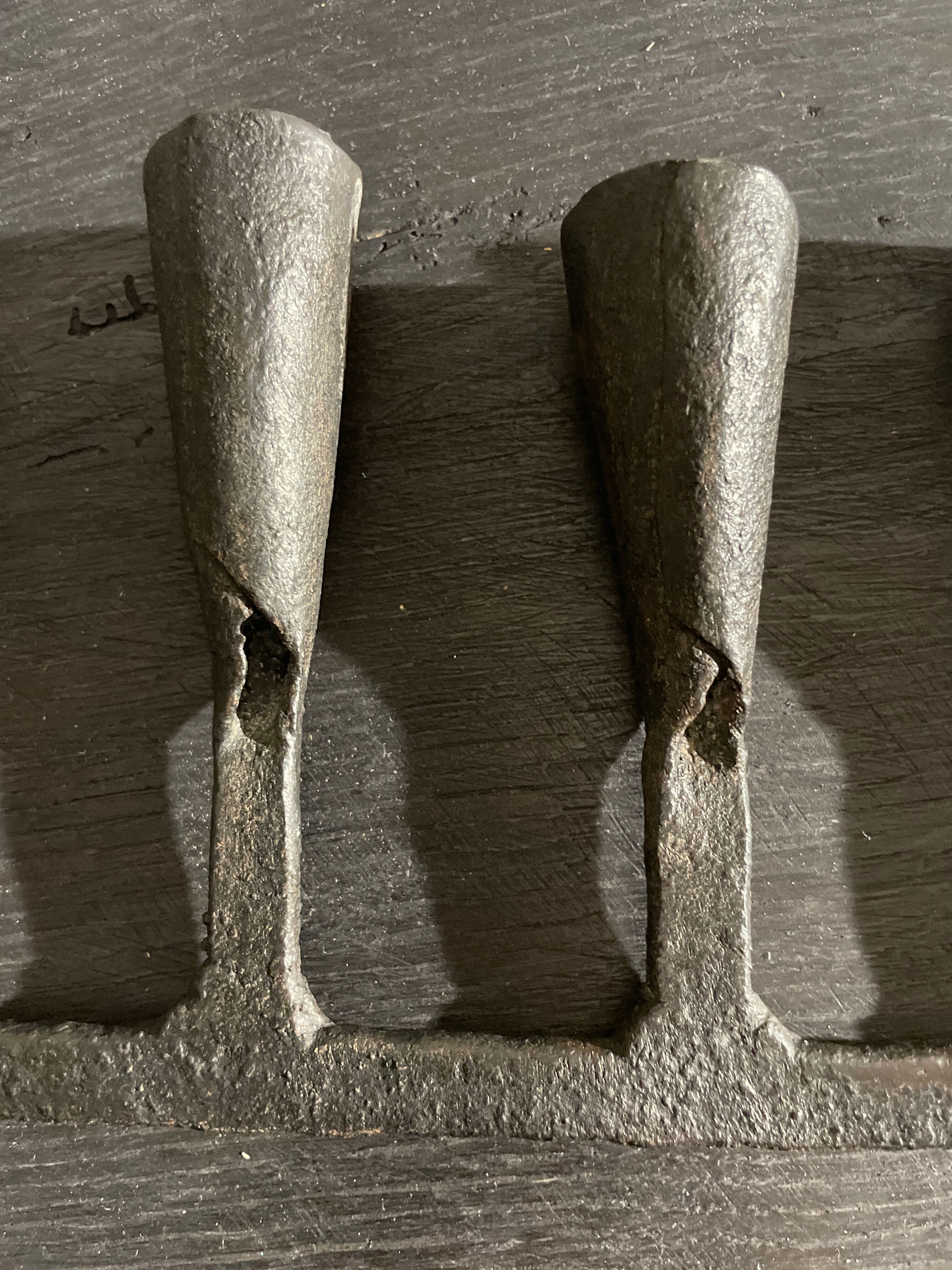 Pair of beaten iron candlesticks