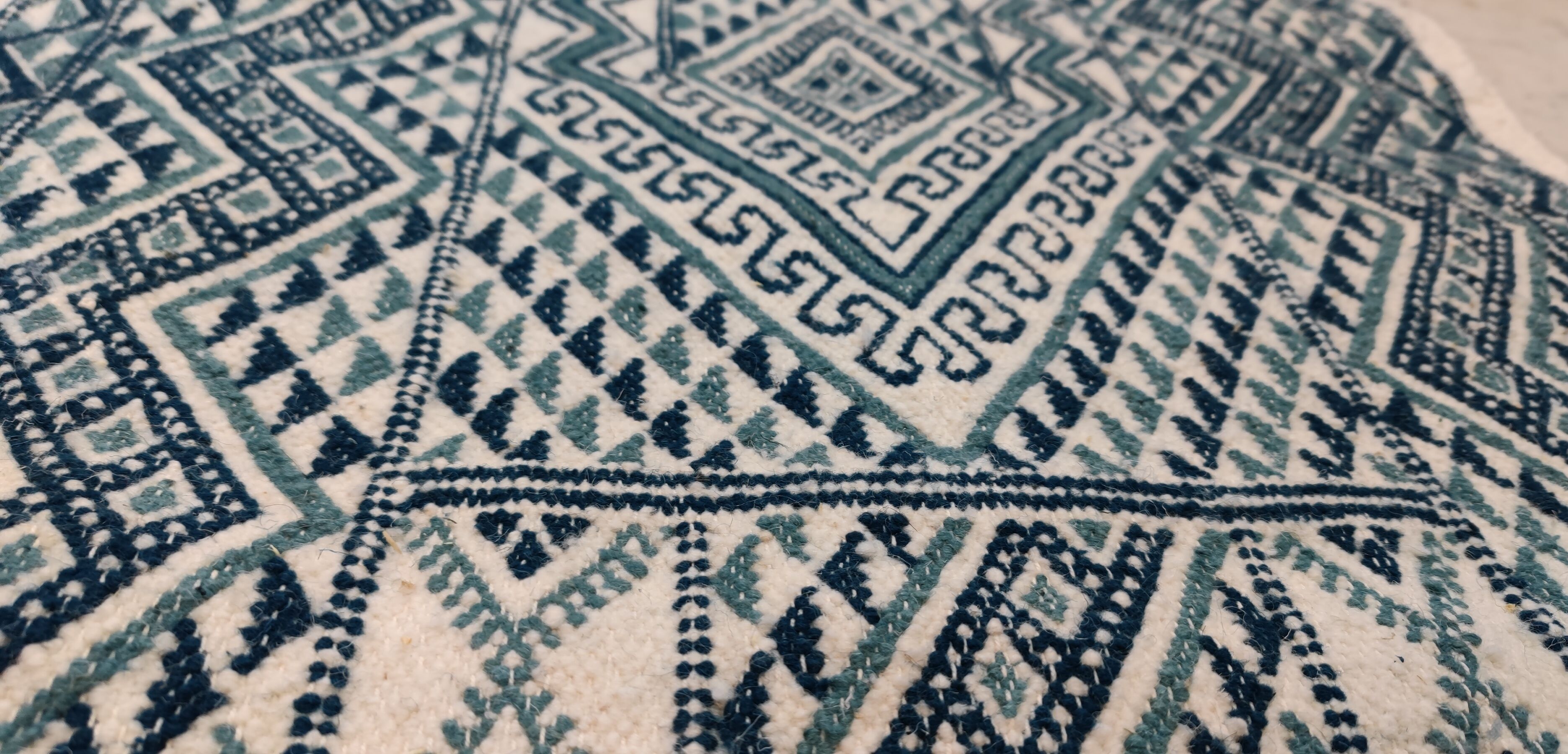 Handmade traditional white and blue carpet, 152x76 cm