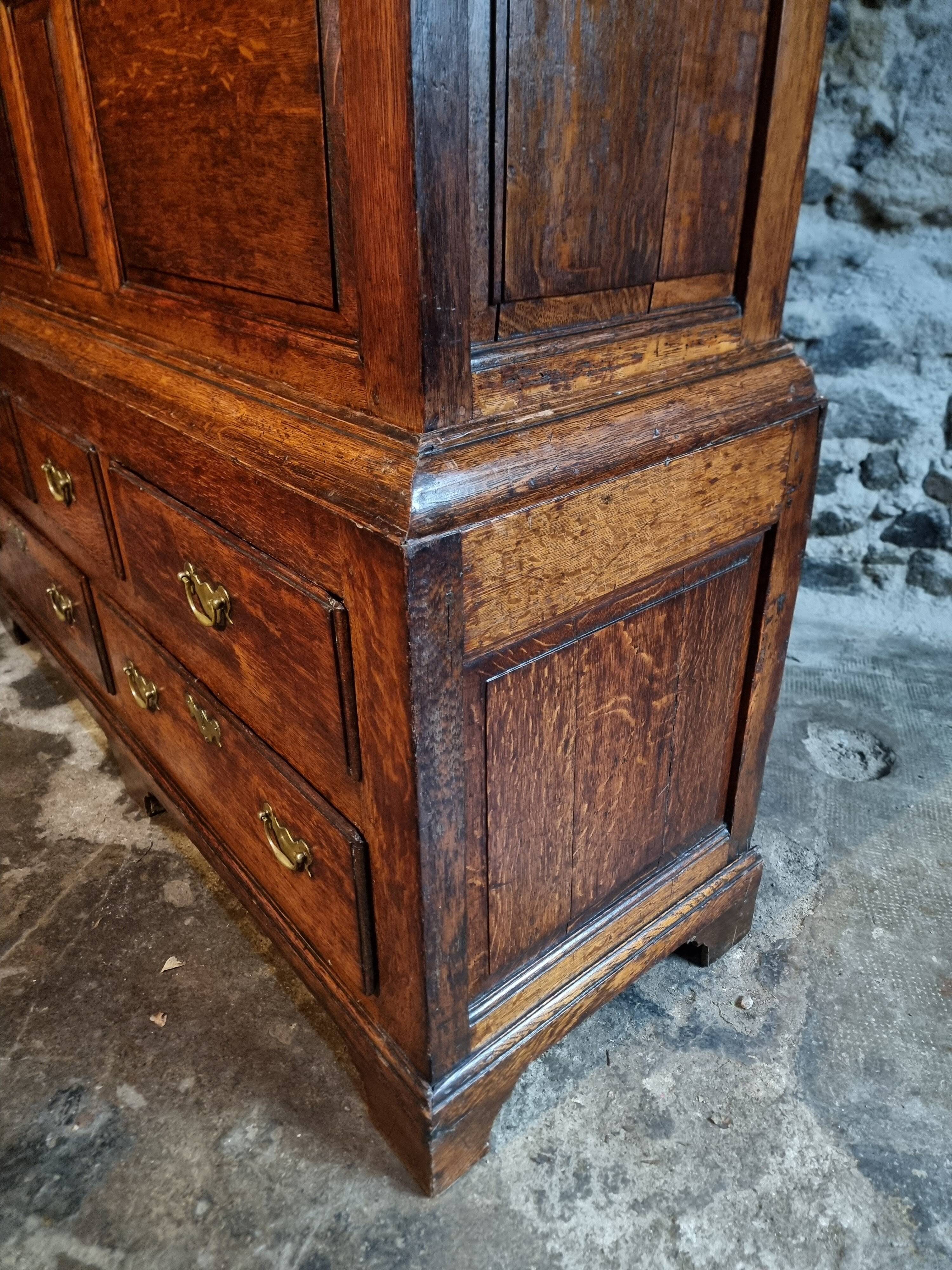 Antique English oak wardrobe with drawers, England, circa 1800–1820.