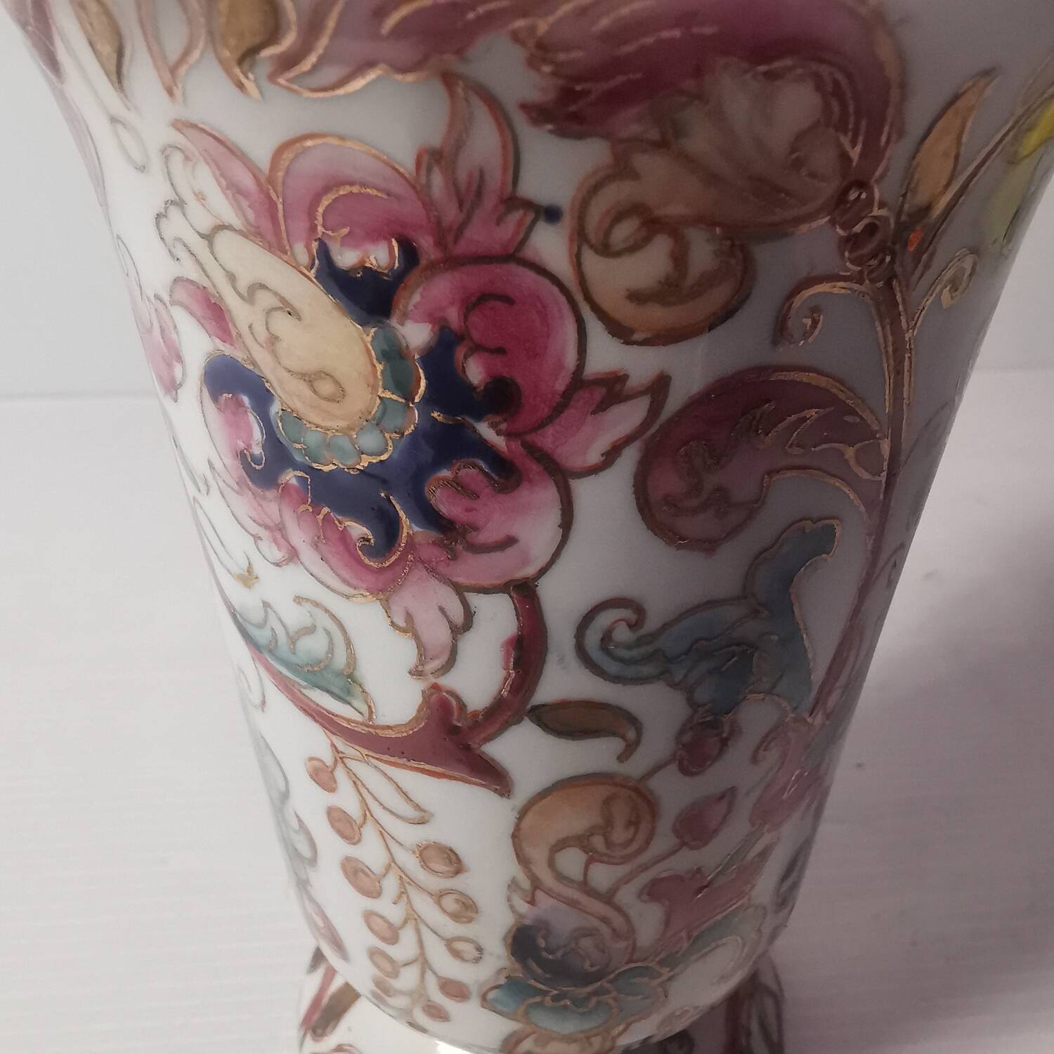 Old vintage vase with floral decor