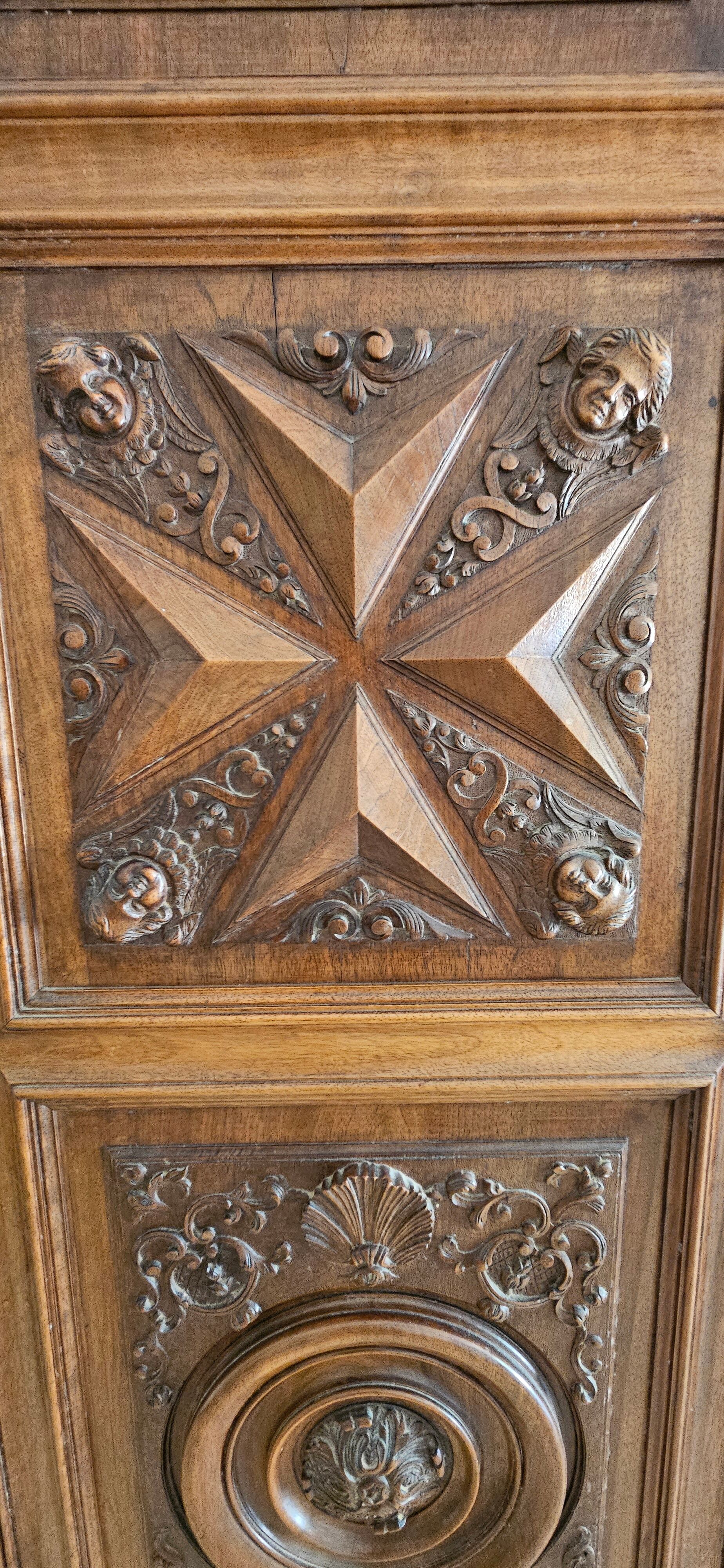 Carved cherubs cabinet