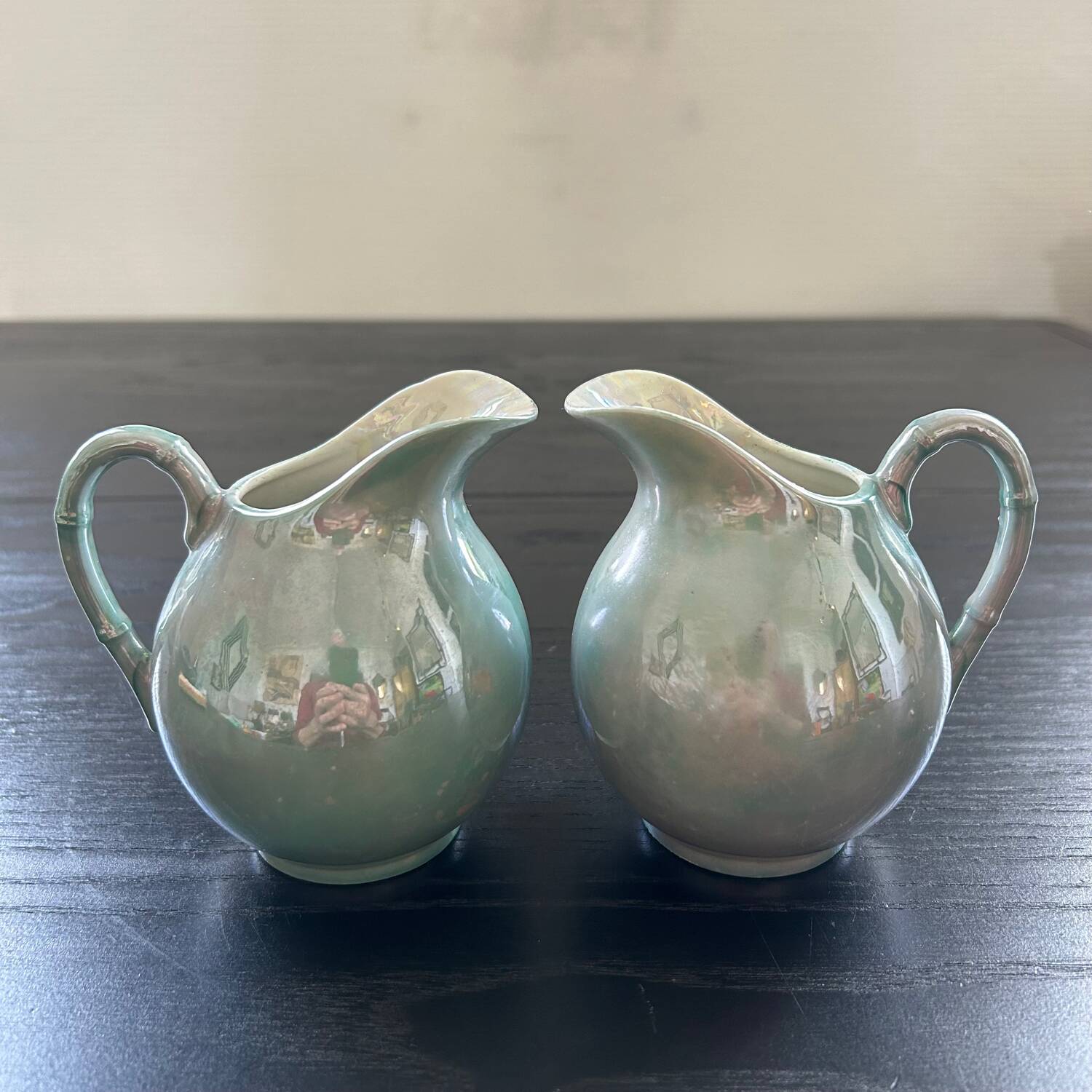Pair of iridescent blue pitchers