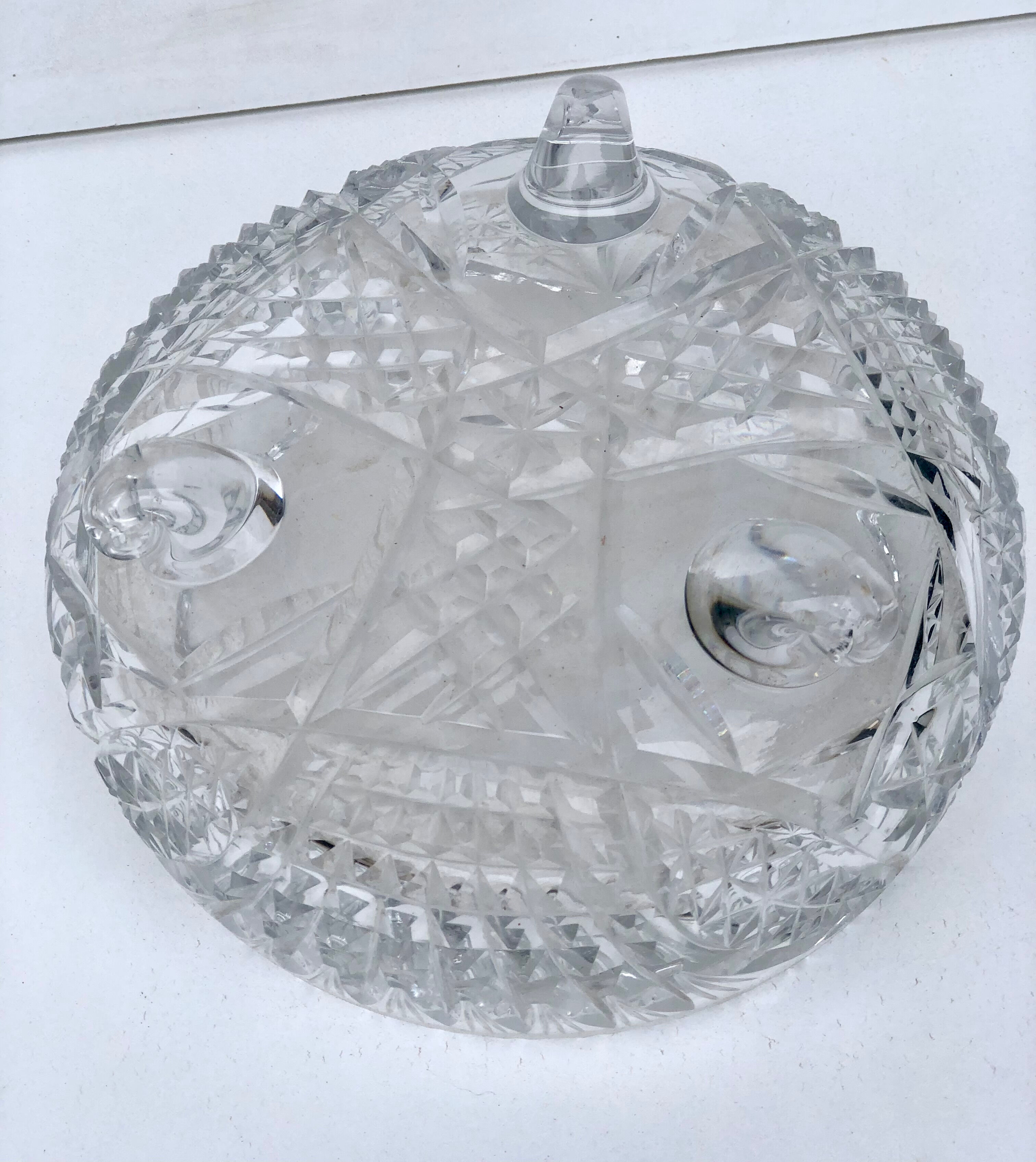 Chiseled glass basket cup on legs