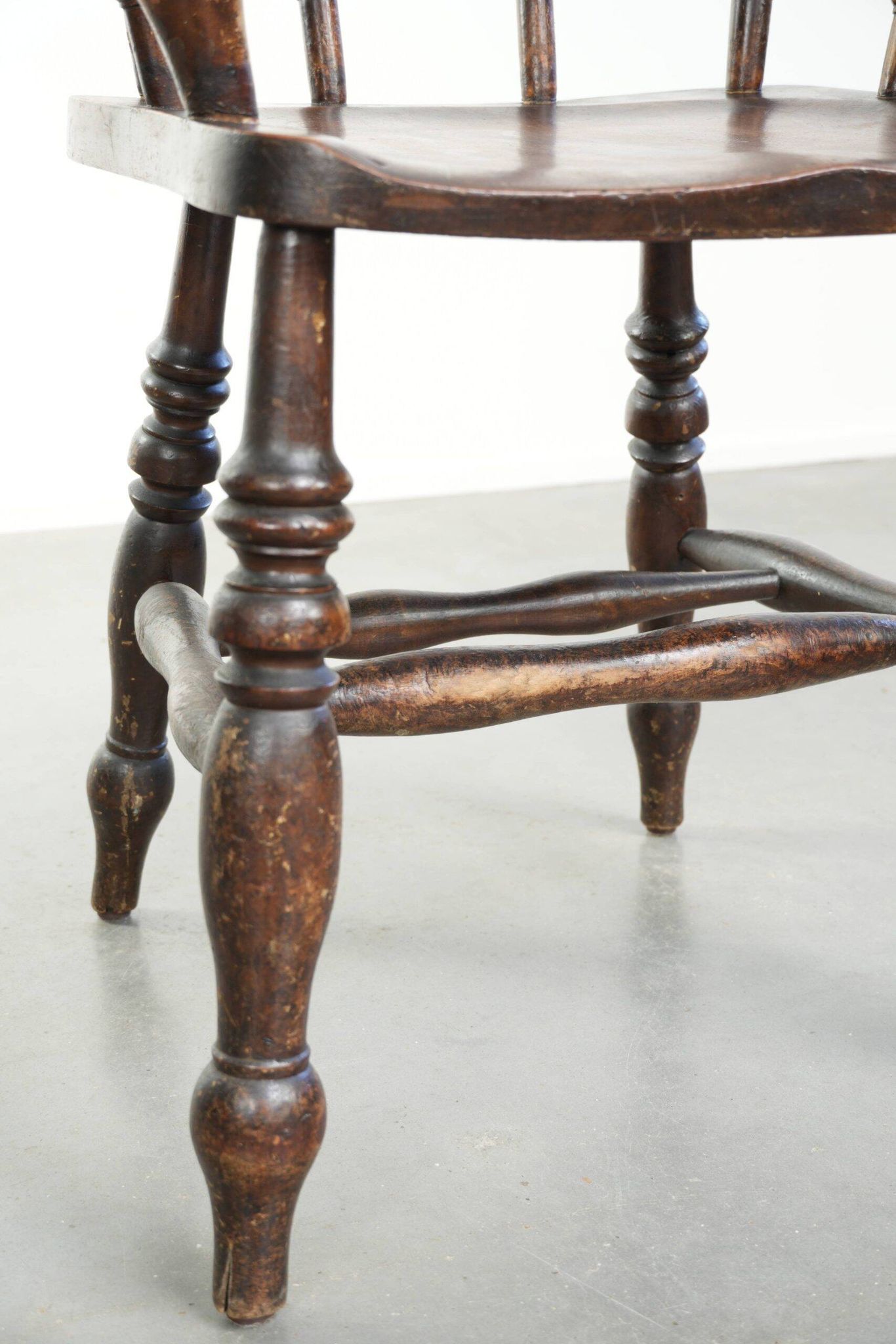 Wooden English antique pub/captain chair from the late 19th century