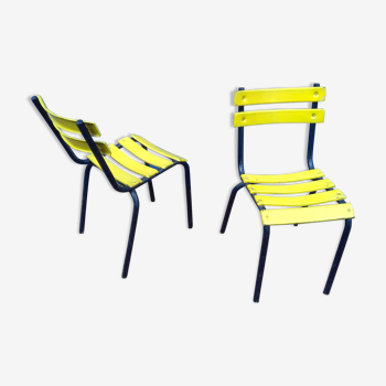 Pair of outdoor bistro chairs in vintage yellow metal