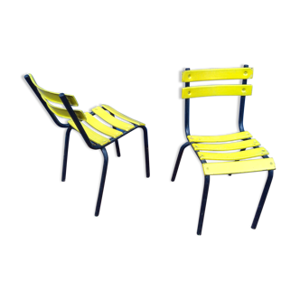 Pair of outdoor bistro chairs in vintage yellow metal