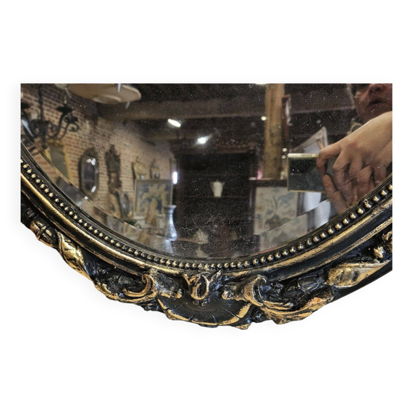 Ancien miroir ovale patiné noir et doré style louis xv