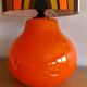 Orange opaline table lamp and vintage fabric