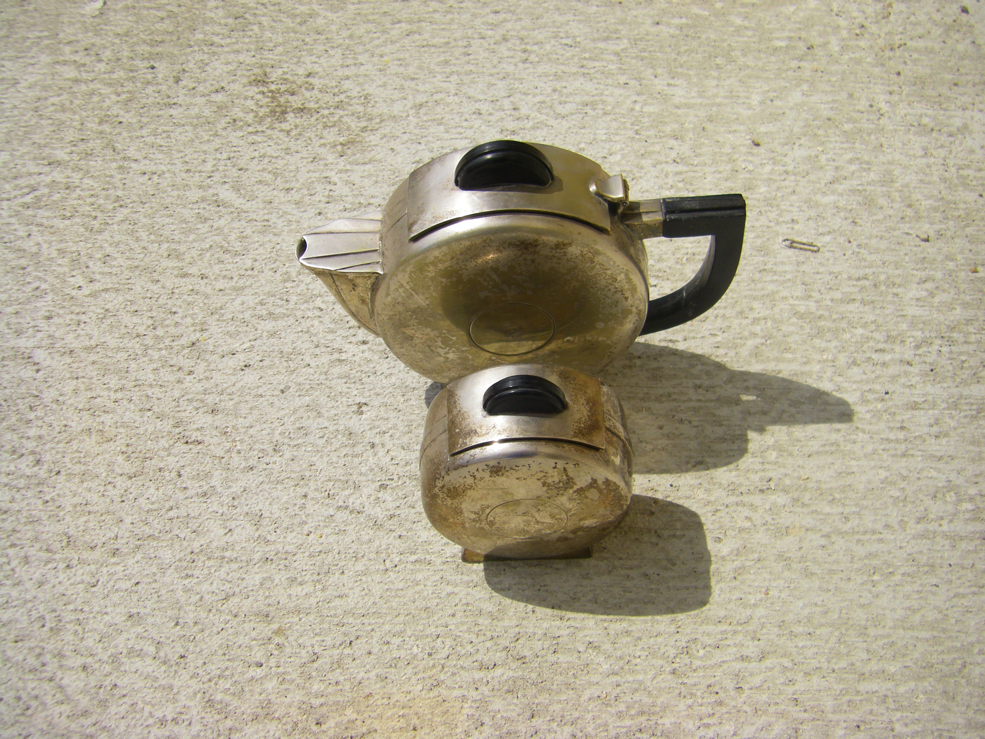 Set of a teapot and a silver metal sugar bowl
