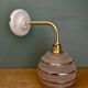 Vintage pink and gold frosted glass globe wall light.
