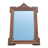 Louis XVI mirror in carved wood, 19th century.