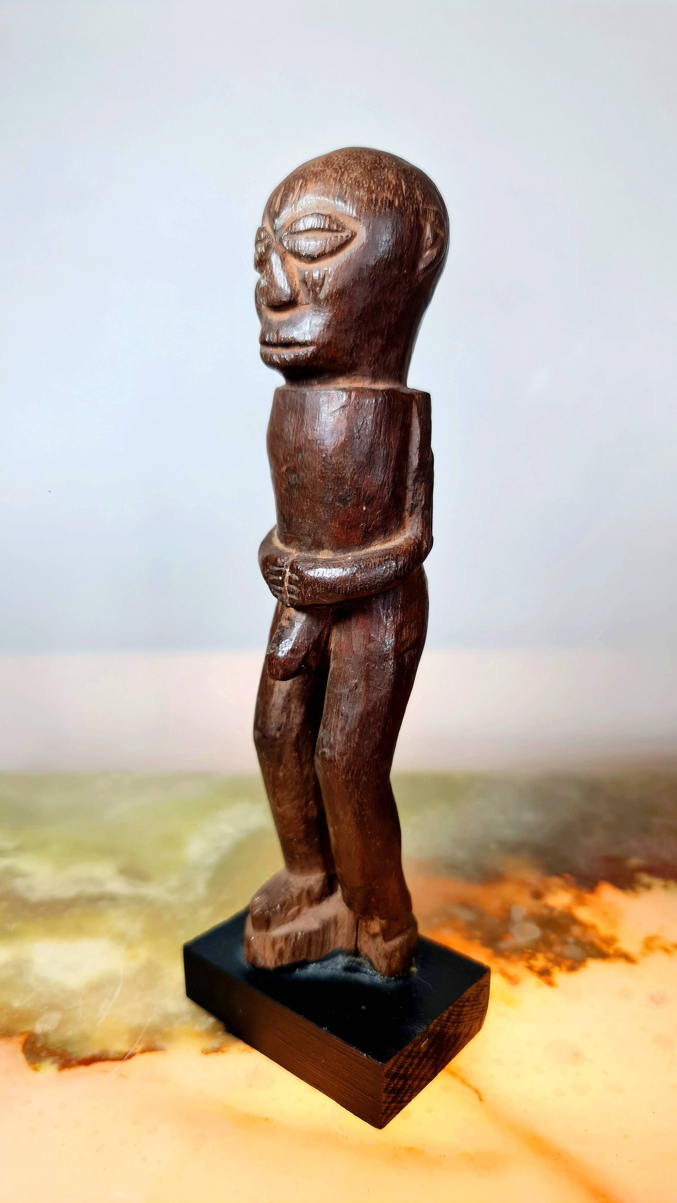 Old Fon statuette on a base, Benin