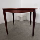 Round teak table with Scandinavian design extensions from the 60s vintage