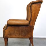Sheepskin wingback chair with a unique design and a beautiful patina