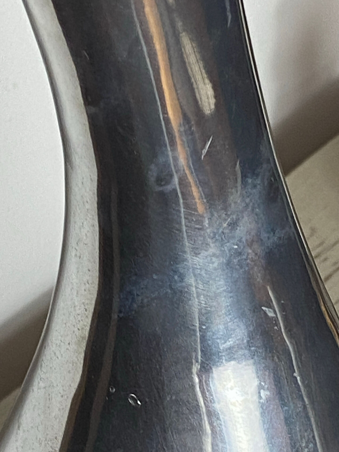 Large organic vase in polished aluminium cast.