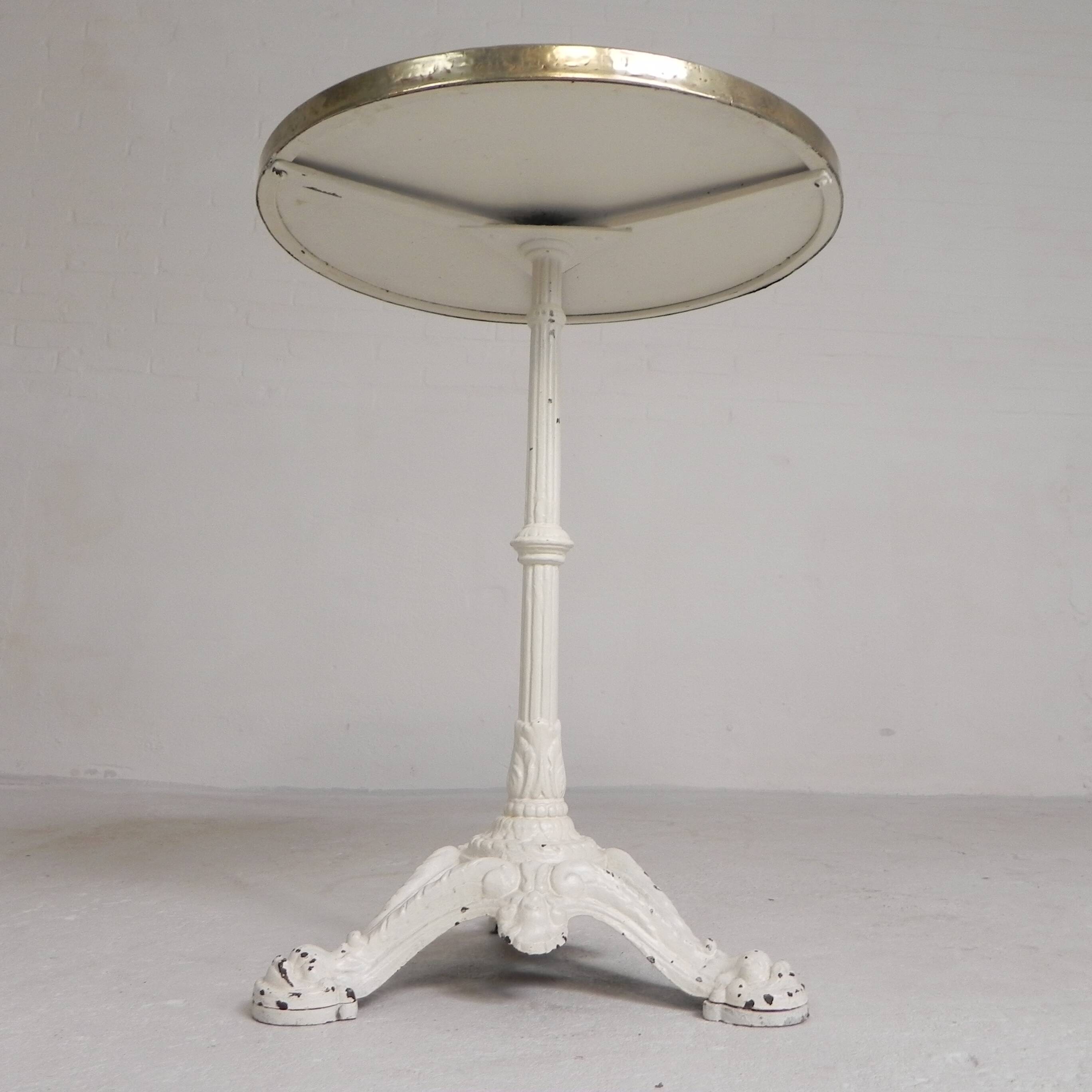 Bistro table with cast iron legs and marble top, 1920s.