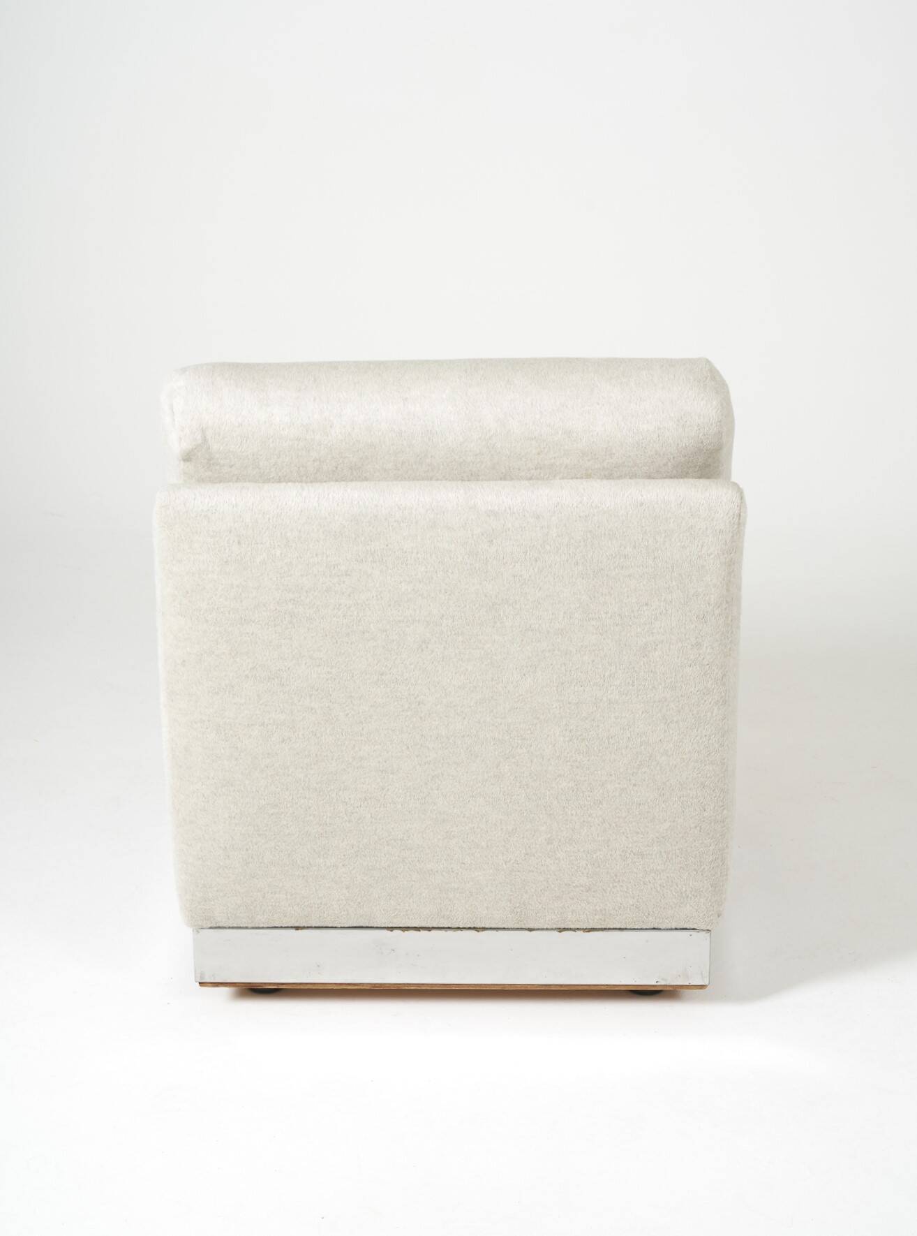 Beige fireside chair by Jacques Charpentier