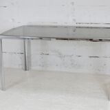 Living table. chrome metal, curved smoked glass slab, france, circa 1970.