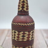 Set of 2 decorative vintage bottles covered with leather & wicker