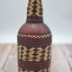 Set of 2 decorative vintage bottles covered with leather & wicker