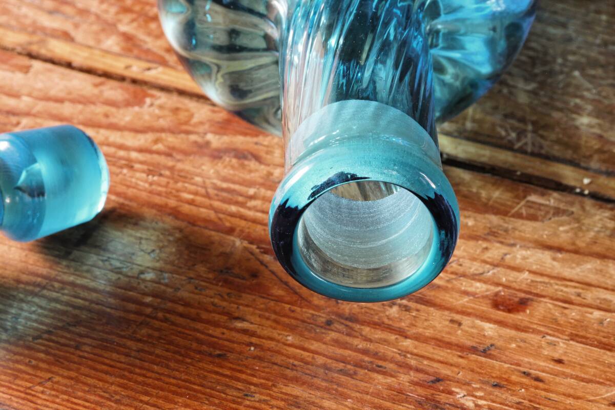 Large blown crystal bottle, twisted, turquoise blue, early 20th century.