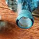 Large blown crystal bottle, twisted, turquoise blue, early 20th century.