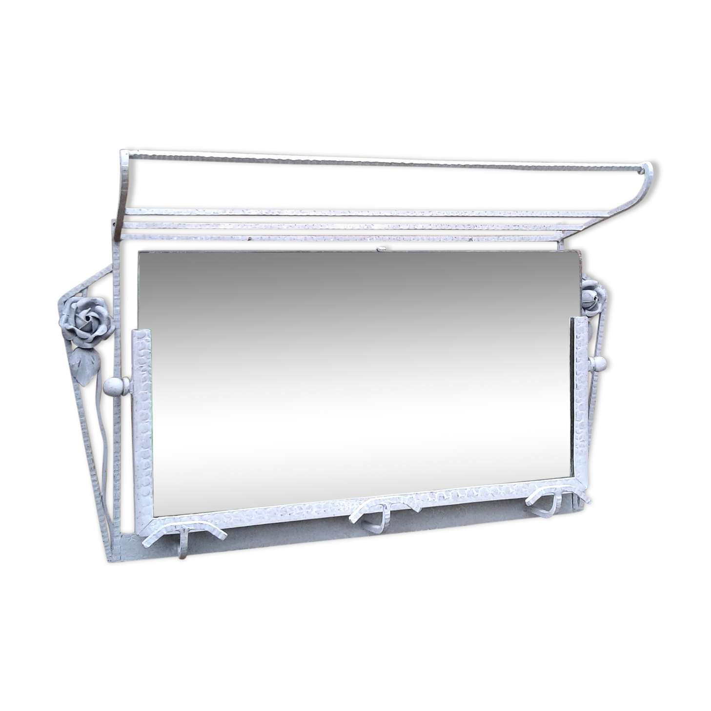 Former Wall coat hangers painted in gray iron