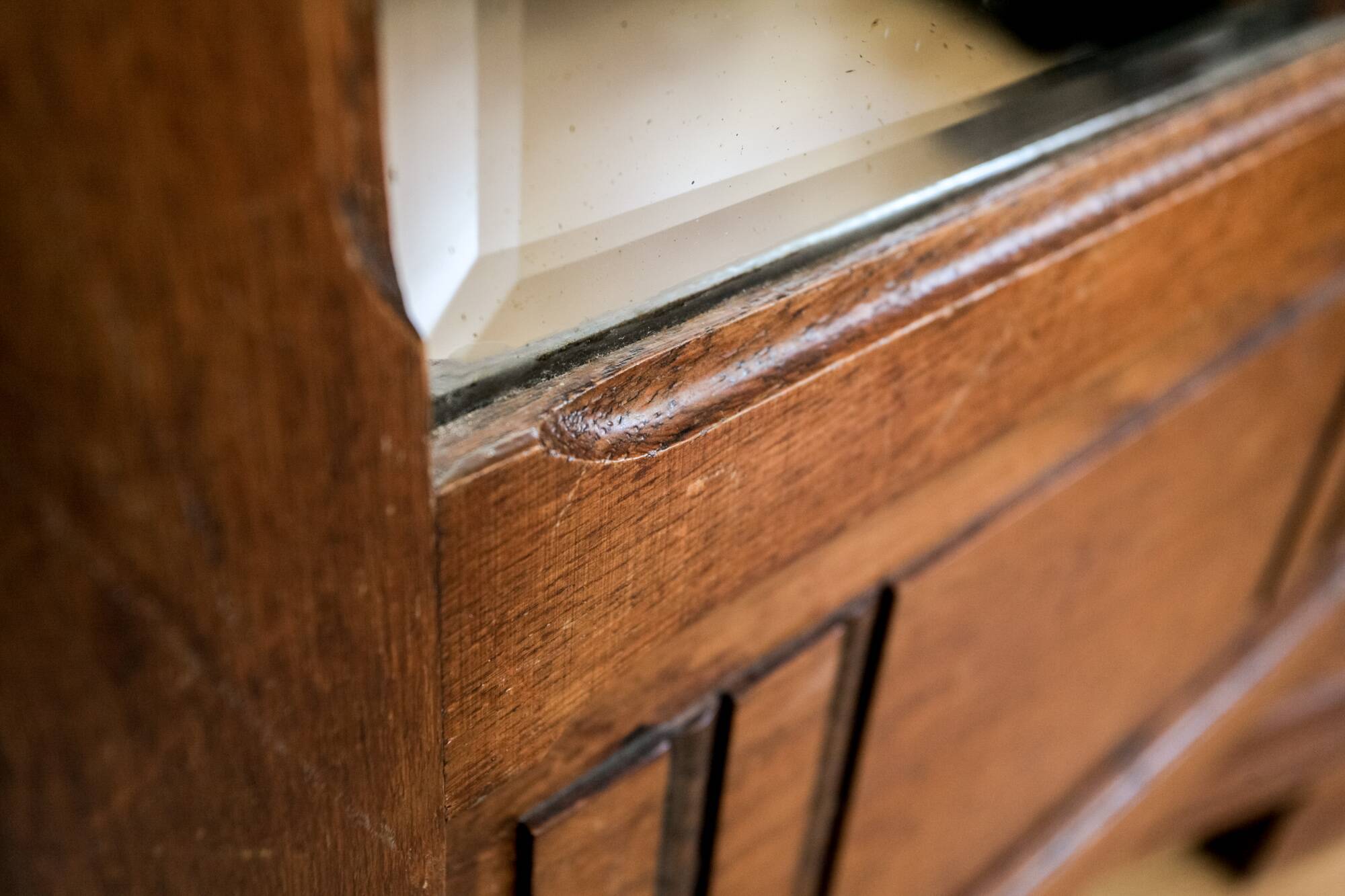 Old solid wood wardrobe with three vintage mirror doors