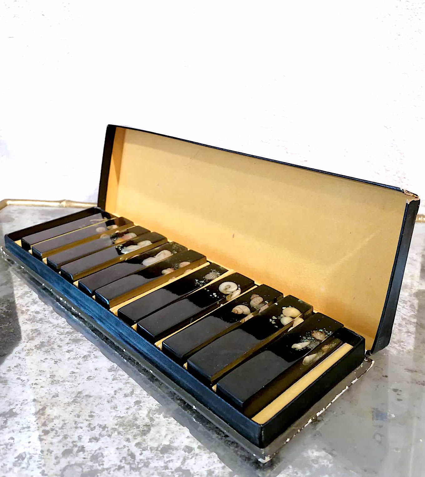 Set of 11 blackened resin knife holders, 1970s