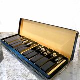 Set of 11 blackened resin knife holders, 1970s