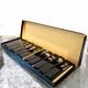 Set of 11 blackened resin knife holders, 1970s