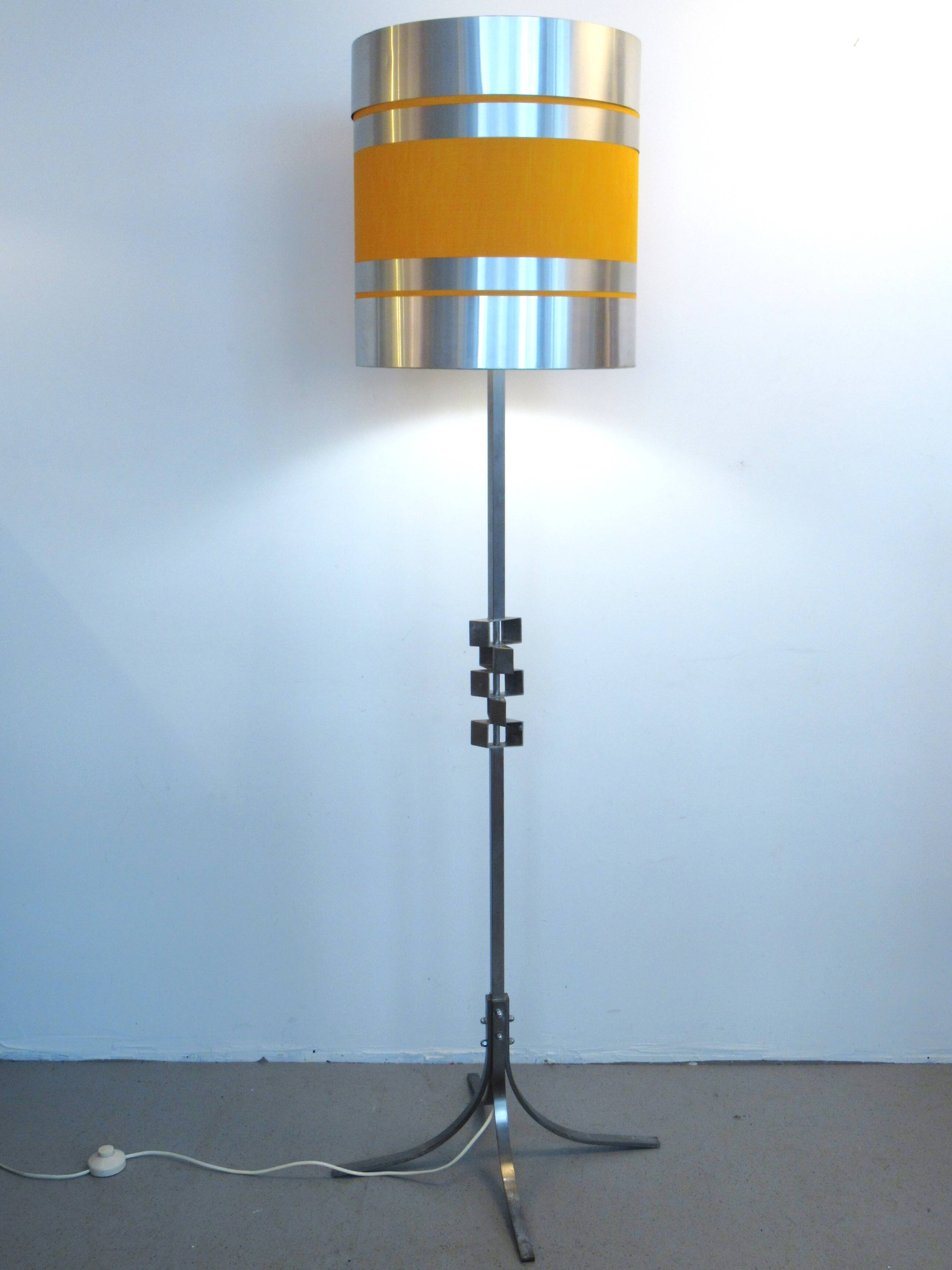 Floor lamp with a large orange shade and metal from the 1960s.