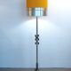 Floor lamp with a large orange shade and metal from the 1960s.