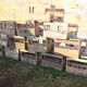 Old box with 10 wooden bottles -bc