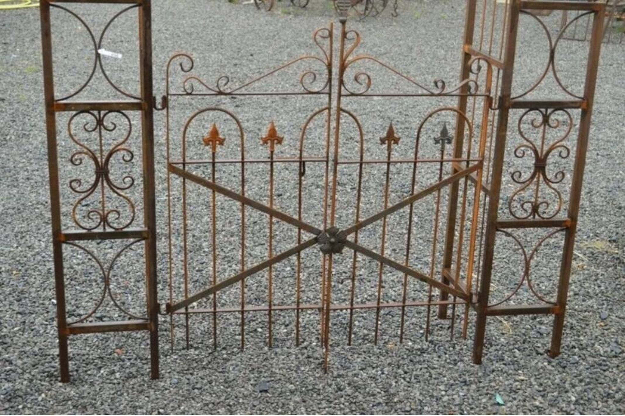Garden arch with wrought iron gate
