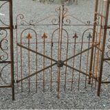 Garden arch with wrought iron gate