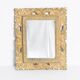 Decorative gold mirror mid-century in a wooden frame, Italy, 1960s.