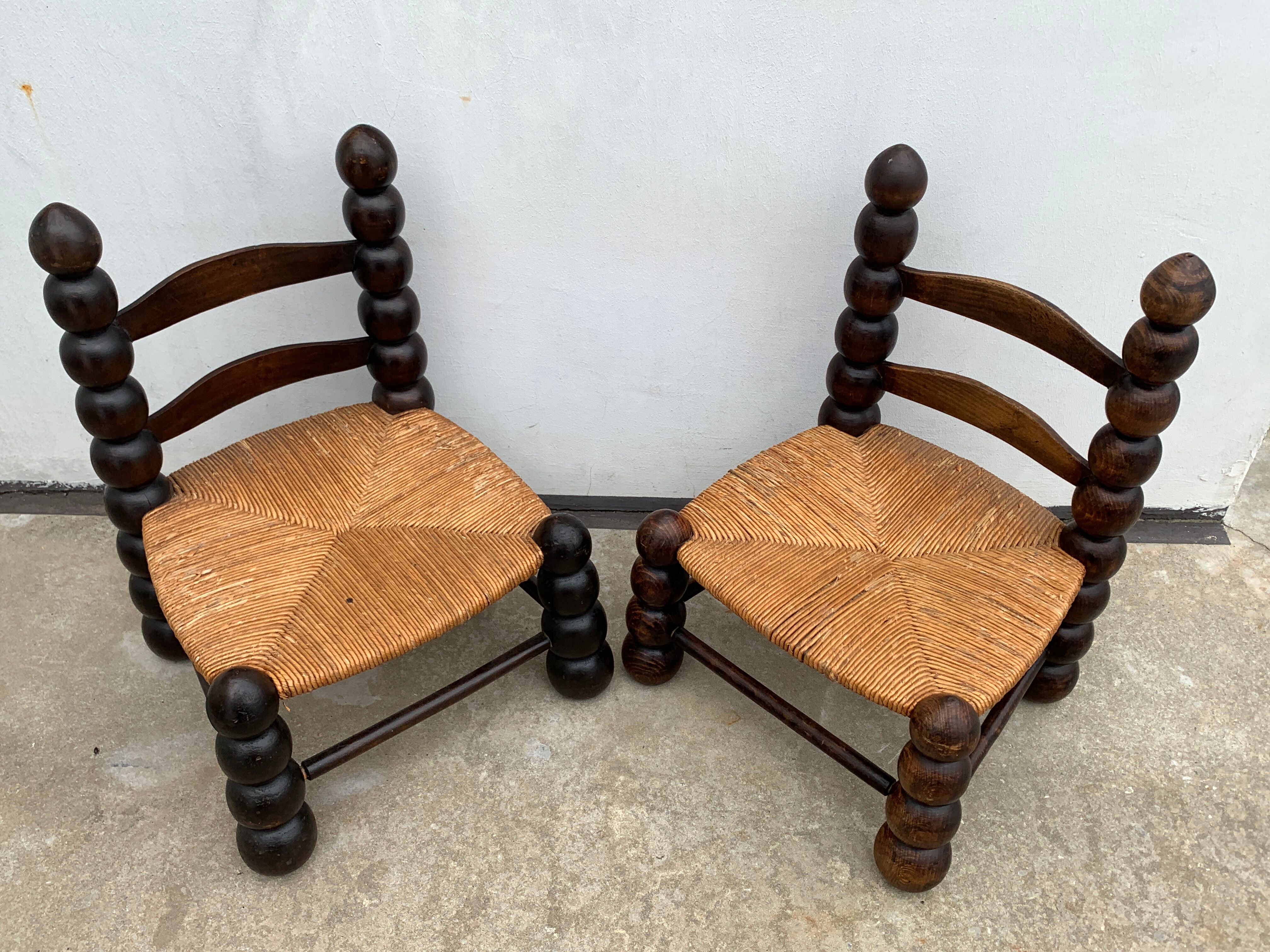 Pair of antique low fire chairs made of wood and straw