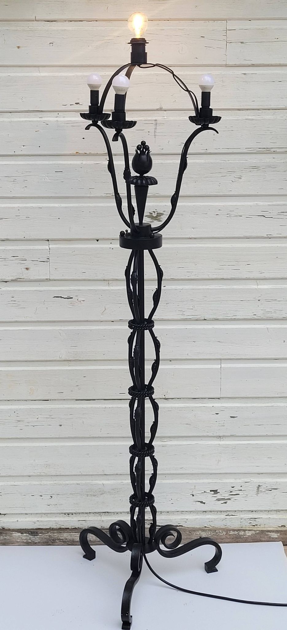 Black wrought iron floor lamp attributed to Gilbert Poillerat