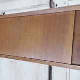 Wall shelf with sliding doors