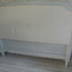 160-style louis XVI style headboard patinated pearl grey waxed finish, lined with grey velvet