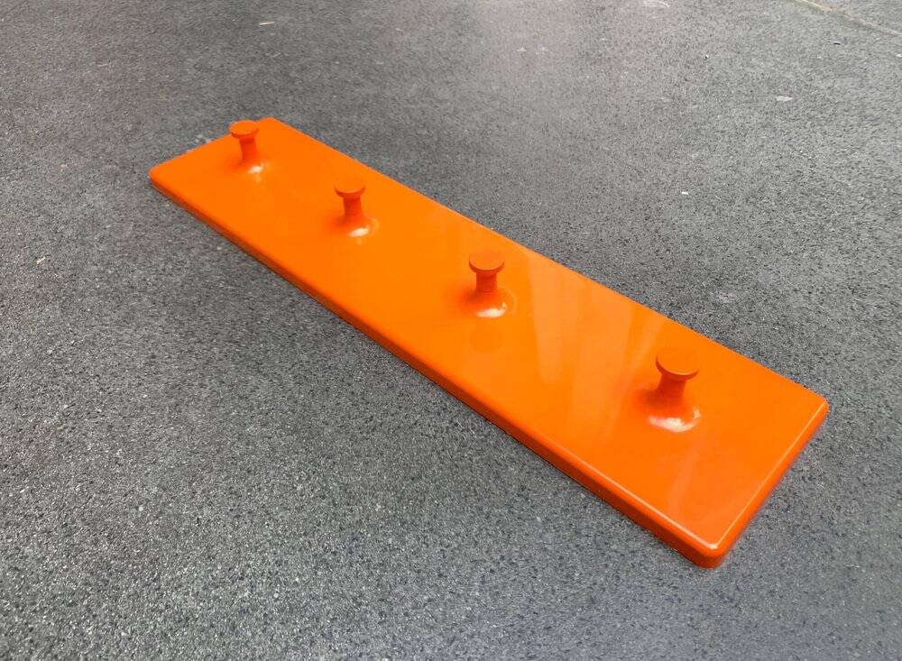Orange coat rack from the mid-century space age, 1960s.