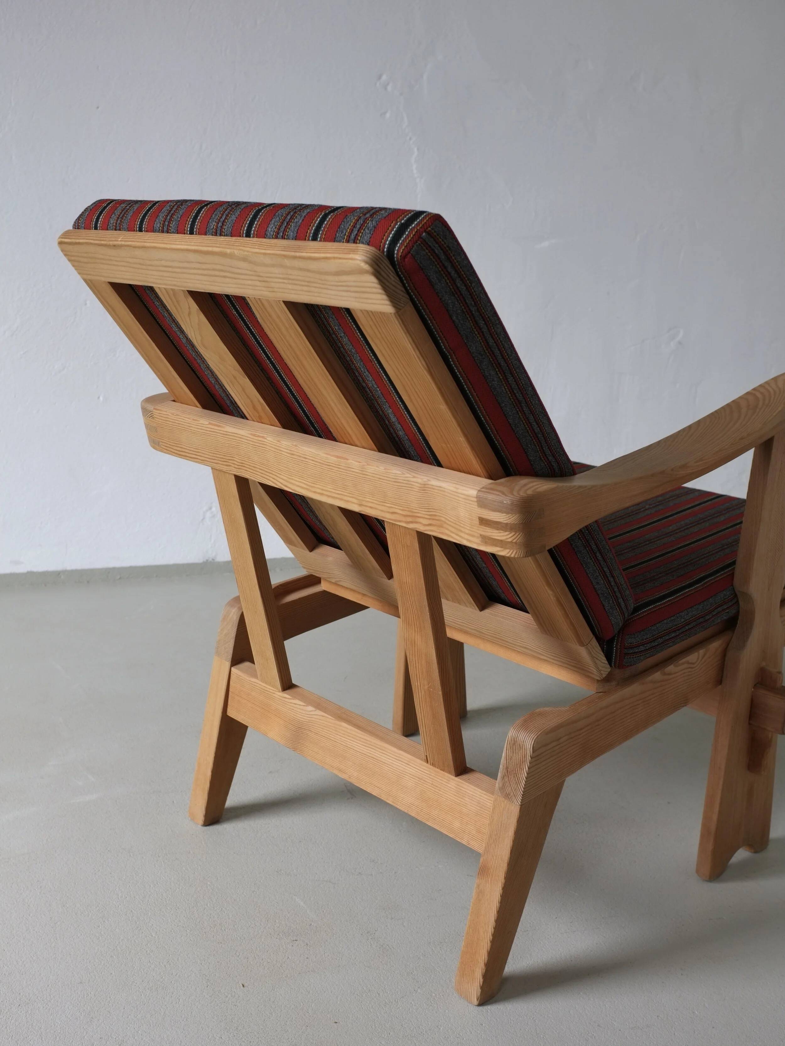 2 carved pine lounge chairs | Scandinavia | 1970s