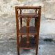 Dark brown bamboo shelf on legs