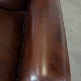 Fauteuil anglais ancien en cuir de mouton