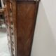 Transitional style chest of drawers in rosewood and amaranth veneer, 20th century.