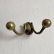 Antique double coat hook in solid brass